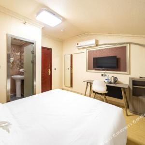 Postel nebo postele na pokoji v ubytování Shanghai Yujia Hotel