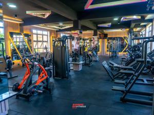 a gym with several treadmills and machines at Express living and wellness in Jinja +1 photo