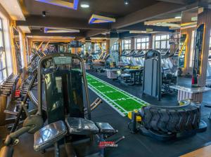 a gym with a gym with a tread machine at Express living and wellness in Jinja