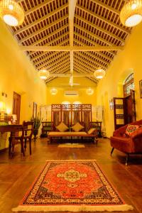 a living room with a couch and a rug at Villa302 in Galle