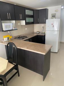 Kuchyň nebo kuchyňský kout v ubytování Departamento frente al mar edificio Arena Plaza