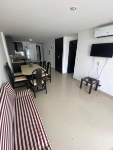 TV a/nebo společenská místnost v ubytování Departamento frente al mar edificio Arena Plaza