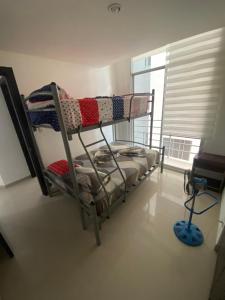 Postel nebo postele na pokoji v ubytování Departamento frente al mar edificio Arena Plaza + 27 fotografií