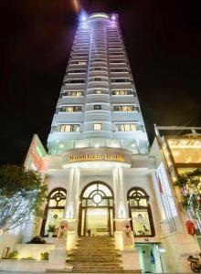a tall building with stairs leading up to it at Moonlight Hotel & Apartment in Da Nang