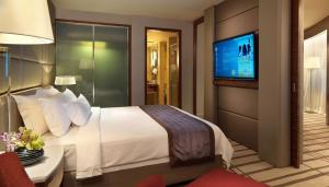 Ένα ή περισσότερα κρεβάτια σε δωμάτιο στο Indochine Hotel Hoi An