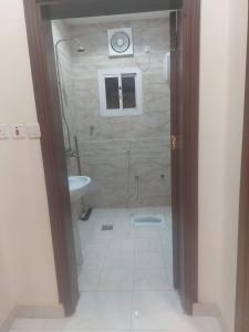 a bathroom with a shower and a toilet and a sink at شقة غرفتين وصالة in Jeddah