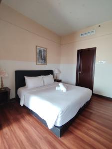 Postel nebo postele na pokoji v ubytování Kuala Lumpur Service Residence Times Square