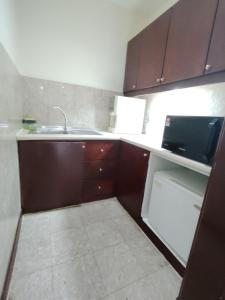 Kuchyň nebo kuchyňský kout v ubytování Kuala Lumpur Service Residence Times Square