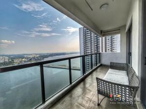 a balcony with a bench and a view of the water at R&F Princess Cove 2, 3BR, Sea View, JB CIQ, by Good Life Homestay in Johor Bahru