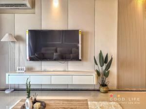 a living room with a large tv on the wall at R&F Princess Cove 2, 3BR, Sea View, JB CIQ, by Good Life Homestay in Johor Bahru +32 photos