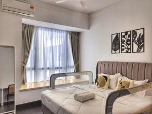 a bedroom with a bed and a large window at R&F Princess Cove 2BR Sea View Family Friendly in Johor Bahru