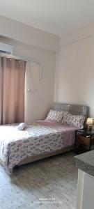 Postel nebo postele na pokoji v ubytování Thyme residences condominium, Unit 208 + 15 fotografií