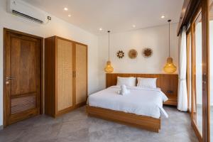 Postel nebo postele na pokoji v ubytování Villa in Canggu with a private pool + 10 fotografií