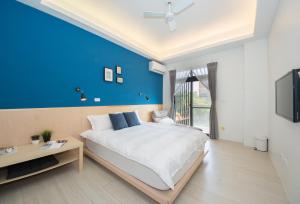 En eller flere senger på et rom på 極簡旅行民宿 Simple Travel B&B