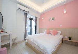 En eller flere senger på et rom på 極簡旅行民宿 Simple Travel B&B