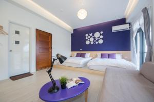 En eller flere senger på et rom på 極簡旅行民宿 Simple Travel B&B