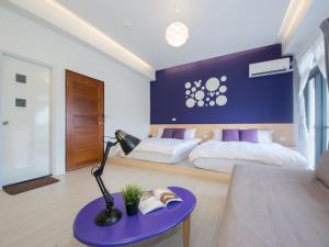 En eller flere senger på et rom på 極簡旅行民宿 Simple Travel B&B