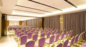 a room with purple chairs in a conference room at Borrman Hotel Nanning Railway Station in Nanning