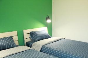 Voodi või voodid majutusasutuse Little Weekend Inn toas