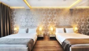 Ένα ή περισσότερα κρεβάτια σε δωμάτιο στο Monopoly Hotel +71 φωτογραφίες