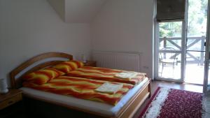 Postel nebo postele na pokoji v ubytování Imola Vendégház