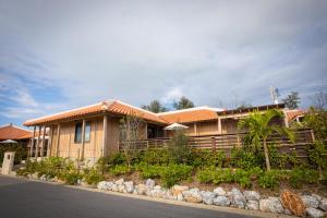 a house with a fence in front of it at Villa Muse Okinawa- Vacation STAY 43816v in Nago
