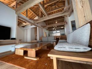 a living room with a wooden table and chairs at Villa Muse Okinawa- Vacation STAY 43816v in Nago