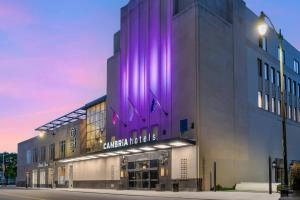 a building with purple lighting on the side of it at Cambria Hotel Detroit Downtown in Detroit