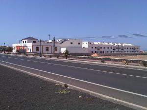 a highway with white buildings on the side of a road at TAO El Cotillo - VV in El Cotillo