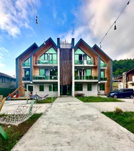a house is shown in front at Snow Forest ԲԱԿՈՒՐԻԱՆԻ-ბაკურიანი-BAKURIANI in Bakuriani