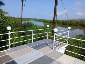 a view from the deck of a boat on a river at Sahil Bed and Breakfast in Alibag