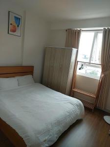 Ένα ή περισσότερα κρεβάτια σε δωμάτιο στο Cozy Apartment 2BR Hacom Phan Rang