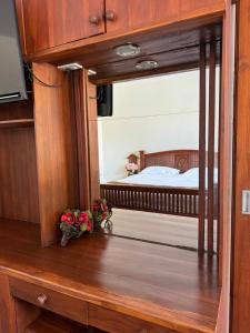 Postel nebo postele na pokoji v ubytování Rommaiplaitawan Resort ร่มไม้ปลายตะวัน รีสอร์ท