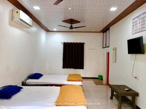 Ένα ή περισσότερα κρεβάτια σε δωμάτιο στο Hotel River Garden Guest House