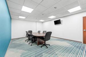 a conference room with a table and chairs at Comfort Suites Gothenburg South in Gothenburg +42 photos