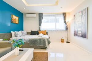 a living room with a bed and a couch at N9 Studentski Loft in Sofia