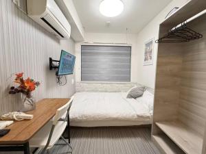 Una cama o camas en una habitación de Shinjuku downtown b3