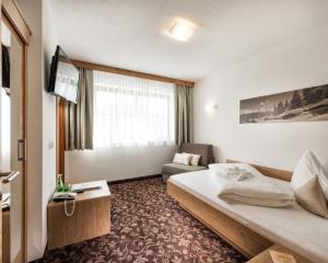 Ένα ή περισσότερα κρεβάτια σε δωμάτιο στο Hotel Puint