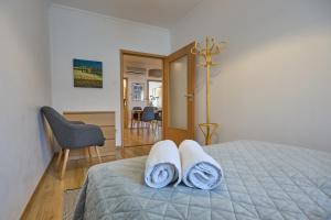 Postel nebo postele na pokoji v ubytování Klára Apartman - a belváros szívében