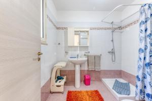 a bathroom with a sink and a toilet at Mauricarol Residences in Acquarica del Capo +40 photos