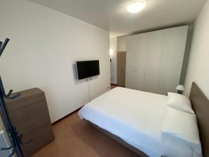 Postel nebo postele na pokoji v ubytování Appartamento La Triade