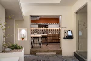 a kitchen and living room with a table in a room at staysai 스테이사이 in Samgong