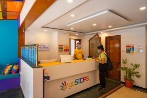 two people standing at a counter in a store at goSTOPS Bengaluru, Gandhi Nagar Majestic in Bengaluru