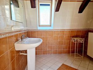 a bathroom with a sink and a window at Gîte de Saint-Gervais in Saint-Gervais +32 photos