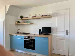 Kuchyň nebo kuchyňský kout v ubytování Résidence grand jardin attenant tennis, mini golf, sauna, pétanque