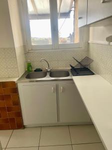 Η κουζίνα ή μικρή κουζίνα στο Appartement cosy +13 φωτογραφίες