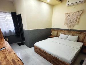 Ένα ή περισσότερα κρεβάτια σε δωμάτιο στο Ong 5 Homestay Can Tho +3 φωτογραφίες