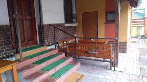 a set of stairs in a building with two benches at Penzión Pars in Žilina