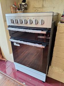an oven with its door open in a kitchen at May Queen Forest Cottage Manjimup in Deeside +17 photos