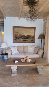 a living room with a couch and a coffee table at Villa with private pool and stunning sea view in Galaxidhion
